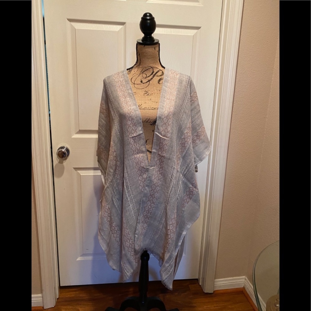 Light weight kimono, 100% polyester.